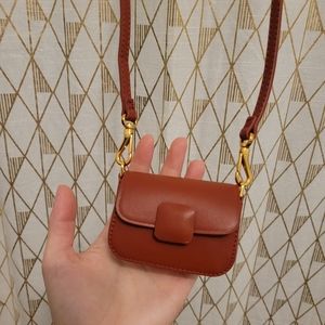 New with box and dust bag Charles & Keith Micro Koa Micropurse in Color Brick